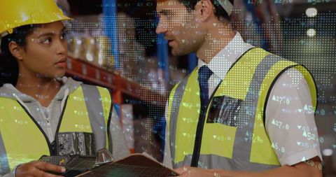 Warehouse supervisors discussing logistics and global finance overlay