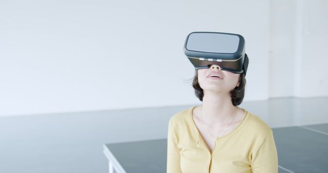 Woman Wearing Virtual Reality Headset in Modern Room - Download Free Stock Images Pikwizard.com