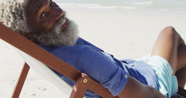 Senior Man Relaxing on Beach Chair at Sunny Seashore - Download Free Stock Images Pikwizard.com