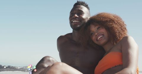 Happy African American Couple Relaxing at Sunny Beach