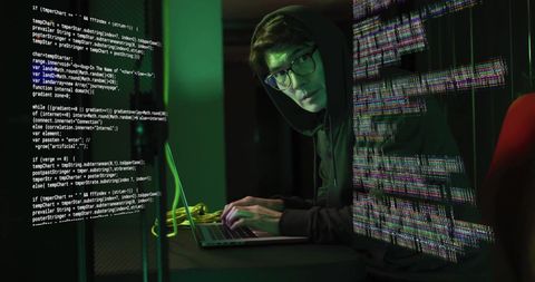Cybersecurity Threat Hacker Typing on Laptop with Code Overlay - Download Free Stock Images Pikwizard.com