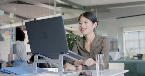 Businesswoman Engaged in Video Call in Modern Office - Download Free Stock Images Pikwizard.com