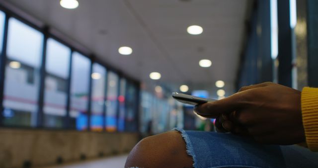 Close-up of Person Using Smartphone in Modern Corridor - Download Free Stock Images Pikwizard.com