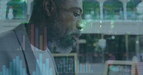 Business Professional Analyzing Complex Financial Charts