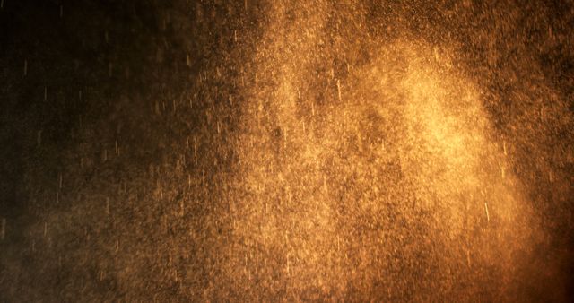 Golden dust particles floating in air with dramatic lighting, creating a mystical and atmospheric effect. Suitable for backgrounds, overlays, digital art, and motion graphics.