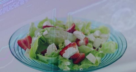 Vibrant Strawberry and Lettuce Salad in Glass Bowl