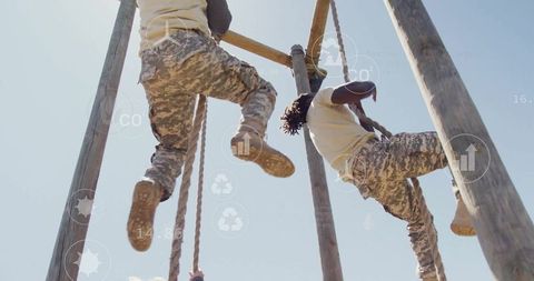 Military personnel racing through challenging outdoor obstacle course