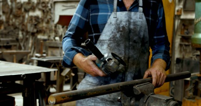 Carpenter Wearing Apron Working in Workshop with Electric Sander - Download Free Stock Images Pikwizard.com