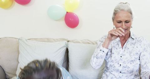 Senior Women Celebrating Joyfully with Colorful Confetti