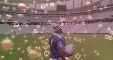 Rugby Player Amid Digital Coronavirus Imagery on Empty Stadium