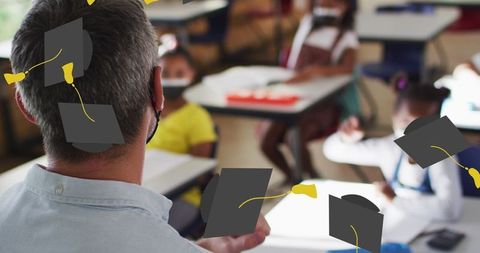 Educator Guiding Diverse Students in Classroom with Covid Safety Measures