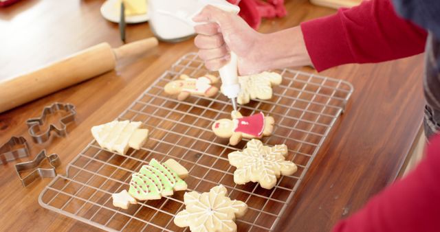 Decorating Christmas Cookies with Icing in Home Kitchen - Download Free Stock Images Pikwizard.com