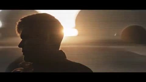 Silhouette of Man Against Striking Sunrise on Sparse Landscape