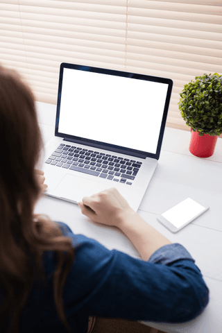 Woman Working at Desk with Laptop and Smartphone Screens Blank - Download Free Stock Videos Pikwizard.com