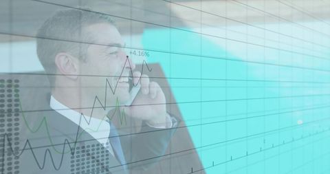 Male executive conversing on smartphone with financial graph