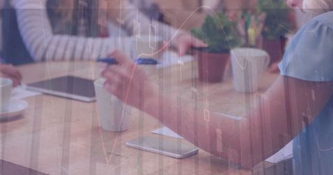 Businesswoman Taking Notes with Digital Graph Overlay