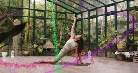 Greenhouse Yoga Flow Practicing Low Lunge Among Tropical Plants for Wellness and Mindfulness