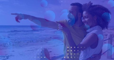 Couple on Beach Enjoying Relaxing Ocean View