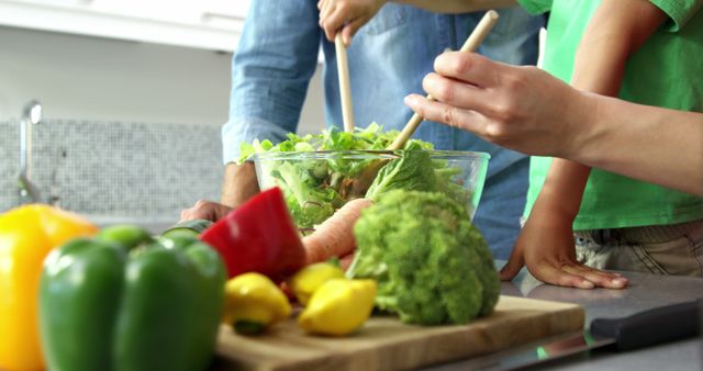 Family Preparing Salad Together in Modern Kitchen - Download Free Stock Images Pikwizard.com