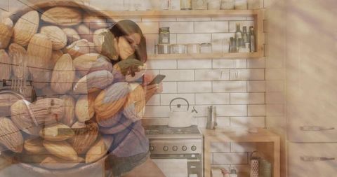 Leaning woman using smartphone in cozy kitchen with almond double exposure