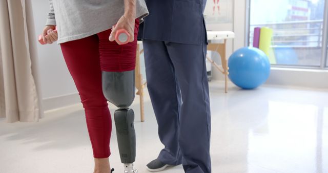 Physical Therapist Assisting Patient with Prosthetic Leg - Download Free Stock Images Pikwizard.com