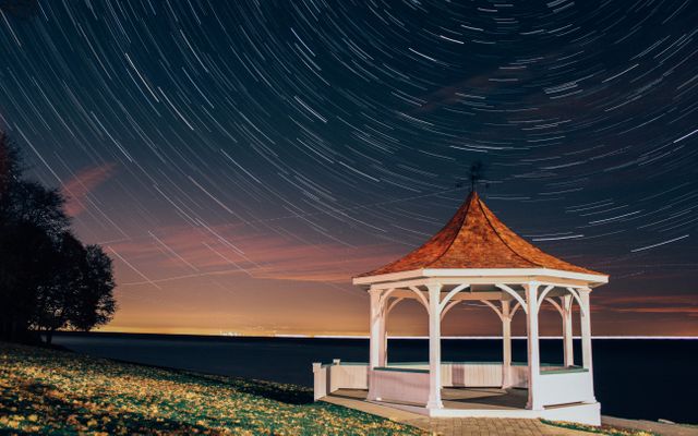 Night Timelapse of Stars over Beachside Gazebo - Download Free Stock Photos Pikwizard.com