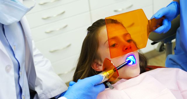 Young Girl Undergoing Dental LED Whitening Treatment - Download Free Stock Images Pikwizard.com