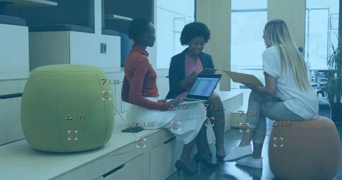 Collaborative Businesswomen Engaged in Active Office Meeting
