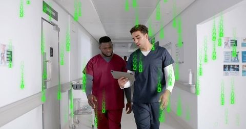 Medical Professionals Using Tablet for Hospital Data Consulting