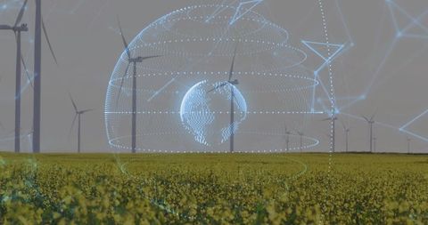 Holographic globe projecting over canola field at wind farm for smart renewable energy networks