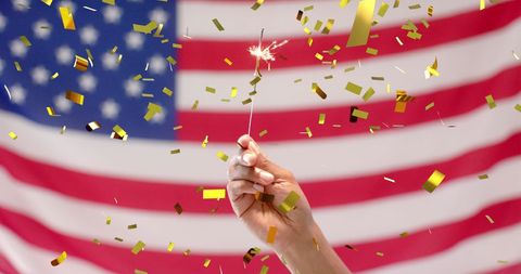 Celebration with Sparkler and American Flag in Background