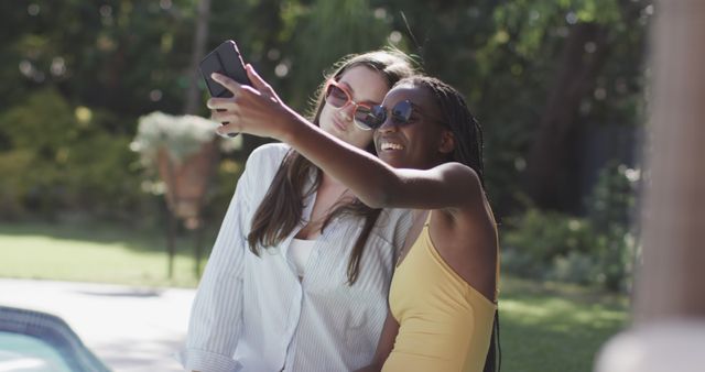 Two Women Taking Selfie in Garden on Sunny Day - Download Free Stock Images Pikwizard.com