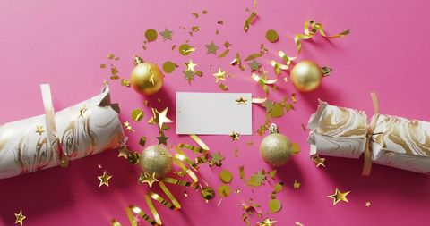 Festive Celebration with Gold Stars and Decorations on Pink Background