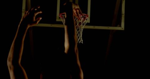 Intense Basketball Dunk by Skilled Athlete in Dimly Lit Gym - Download Free Stock Images Pikwizard.com