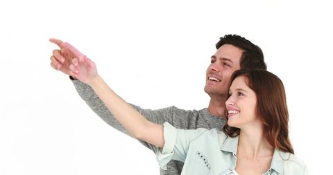 Happy Cheerful Couple Pointing with Excitement - Download Free Stock Images Pikwizard.com