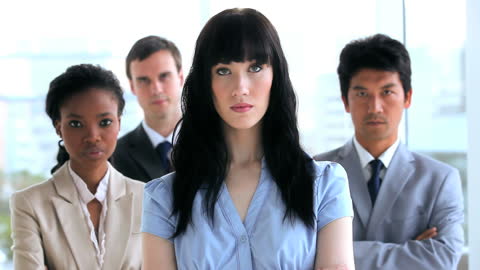 Confident Diverse Team Standing with Arms Crossed in Modern Office