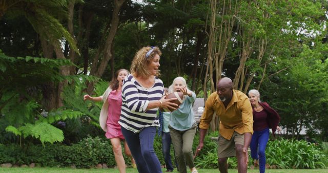 Senior adults enjoying a lively game of football in a lush park. Great for depicting active senior lifestyles, promoting outdoor activities, or illustrating social bonding in older age groups. Can be used in health and wellness publications, retirement community advertisements, and fitness promotions for seniors.