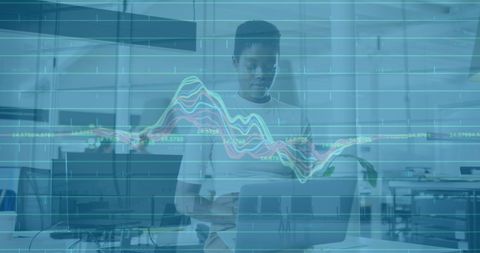 entrepreneur engaging with digital financial data in modern workspace - Download Free Stock Images Pikwizard.com