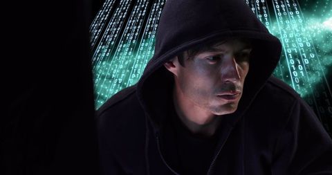 Hacker in Hoodie Focused on Digital Interface with Binary Code - Download Free Stock Images Pikwizard.com