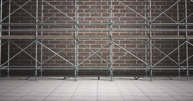 Digital composite image showing scaffolding structure against brick wall in a street. Useful for construction industry themes, renovation projects, safety equipment instruction materials, and building process visualizations.
