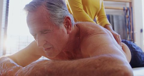 Mature Man Receiving Therapeutic Massage for Relaxation - Download Free Stock Images Pikwizard.com