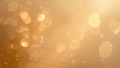 Glowing Golden Bokeh with Floating Particles and Warm Luminescent Abstract Background