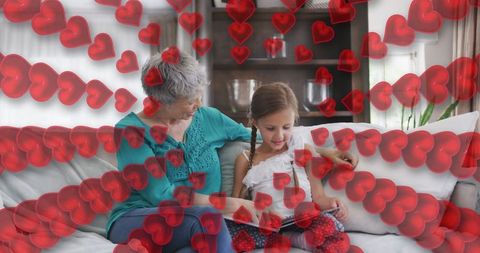 Heartfelt Bonding: Grandmother and Granddaughter Reading Together