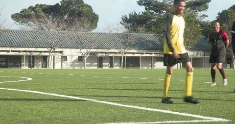 Soccer Player Walking on Field During Practice Match