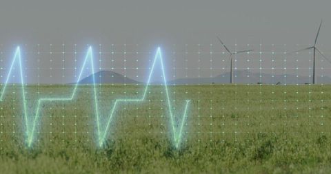 Futuristic ecg wave overlaying verdant wind farm landscape