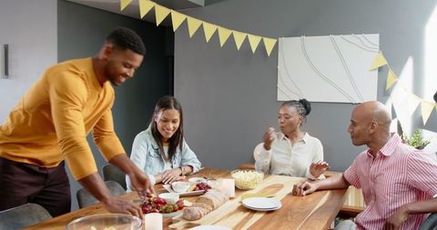 Diverse Friends Enjoying Fun Celebration at Home Gathering