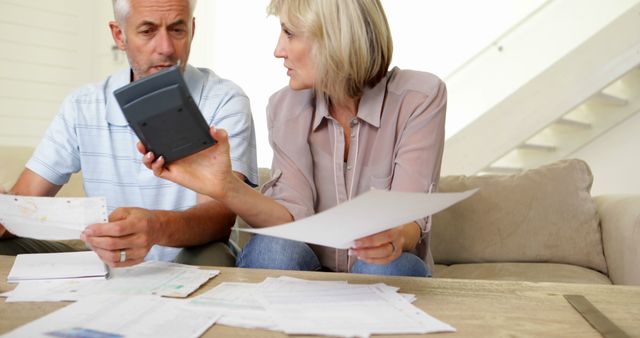 Senior Couple Discussing Finances and Reviewing Bills at Home - Download Free Stock Images Pikwizard.com