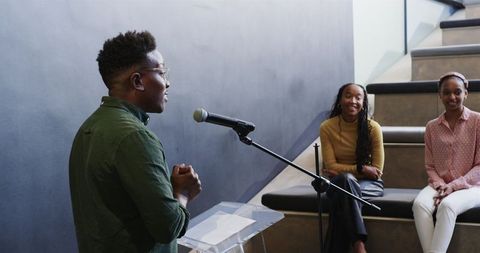 African american man awarded certificate in modern office environment
