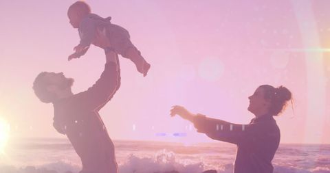 Sunset Family Adventure: Parents Play with Baby at Beach - Download Free Stock Images Pikwizard.com