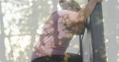 Woman Climbing Obstacle Course with Nature Overlay